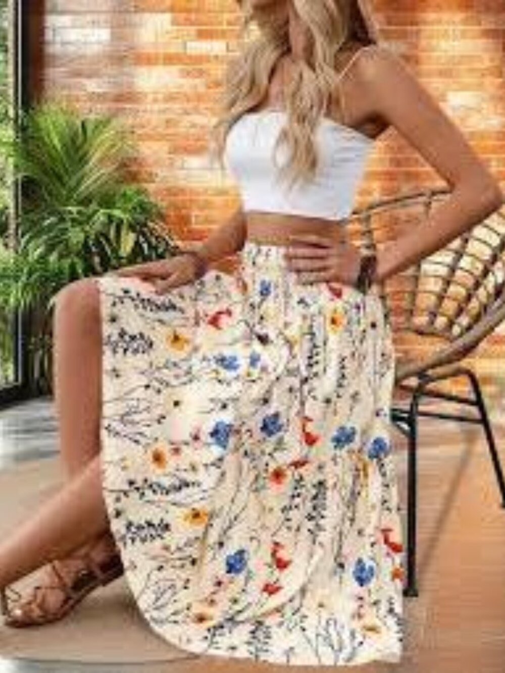 Multi-colored floral print maxi skirt with orange, yellow, and blue flowers